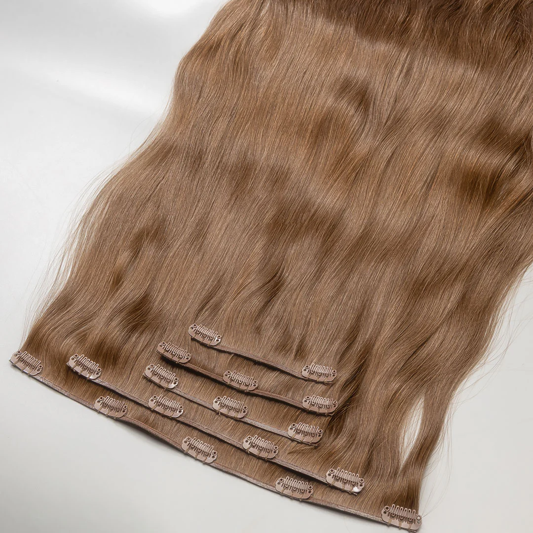 A set of clip-in hair extensions in lightest brown color, displayed on a white background.