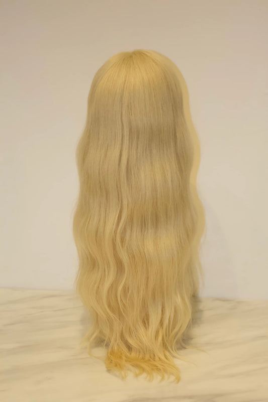 A platinum blonde wig with a soft texture and a pre-plucked hairline with baby hairs, displayed against a white background.